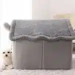 Side view of grey plush dog house with covered roof and soft walls