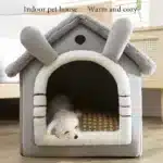 Close-up view of plush fabric entrance of cozy indoor dog house bed