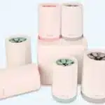 Soft silicone-bristled pet paw washer cup in teal, with flexible inner bristles and carry strap
